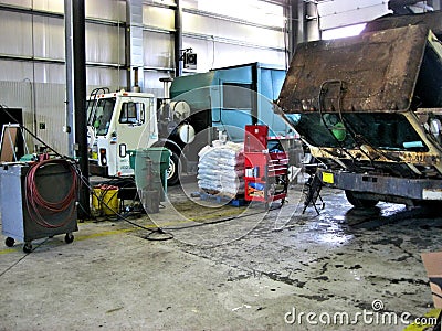 Garbage truck garage Stock Photo