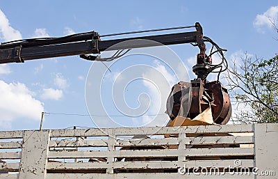 Garbage truck with manual hydraulic. Claws of mechanical moving arm. Stock Photo