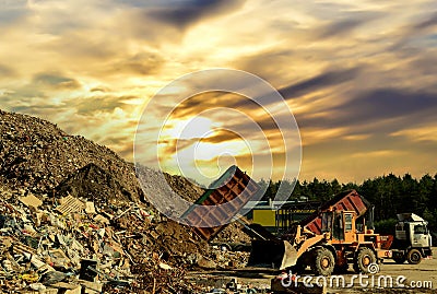 Garbage truck unloads construction waste from container at the landfill. Recycling waste concrete and demolition material. Editorial Stock Photo