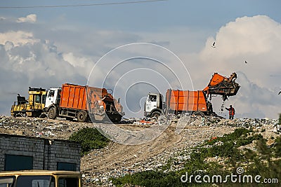 A garbage trucks unloads garbage at a large landfill near Kyiv, Ukraine. May 2016 Editorial Stock Photo