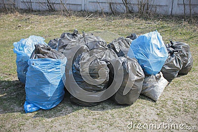 garbage and waste in black and blue bags Stock Photo