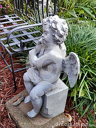 Garden Angel in repose Stock Photo