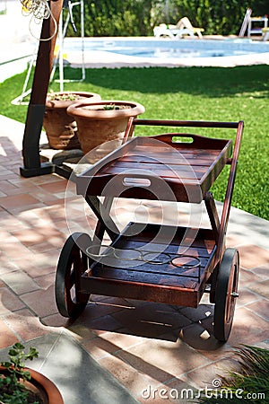 Garden cart and swimming pool Stock Photo