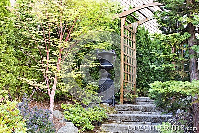 Garden Entrance with Arbor and Stone Steps Stock Photo