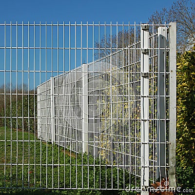 Garden fence and gate in rigid wire mesh panels Stock Photo