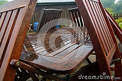 Garden furniture on a disappointingly wet summer day Stock Photo