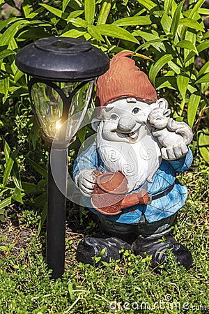 Garden gnome and lamp Stock Photo