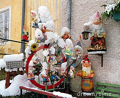 Garden gnomes covered with snow Stock Photo