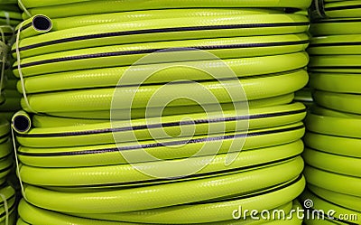 Garden hose in a roll for watering. Garden tools Stock Photo