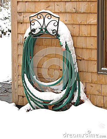 Garden hose in winter Stock Photo