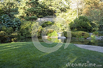 Garden with nice lawn and pond Stock Photo