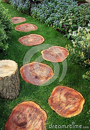 Garden path with wood and lawn Stock Photo