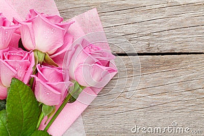 Garden pink roses bouquet over wooden table Stock Photo