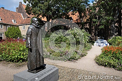 Garden of the Prinsenhof museum in Delft with statue of William of Orange Editorial Stock Photo