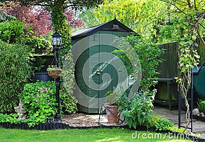 Garden Shed with log store Stock Photo