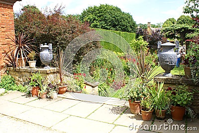 Garden stairway with vintage urns and flower pots or vases Stock Photo