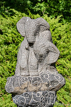 Garden statue of two small elephants made of stone Stock Photo