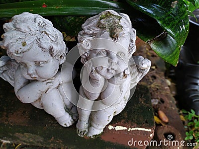 Garden statues girls sad in thailand Stock Photo