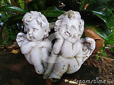 Garden statues girls sad in thailand Stock Photo