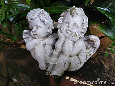 Garden statues girls sad in thailand Stock Photo