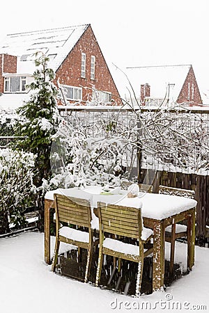 Garden table and chairs under snow Stock Photo