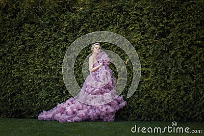 Garden there lovely blonde in a dress. Stock Photo