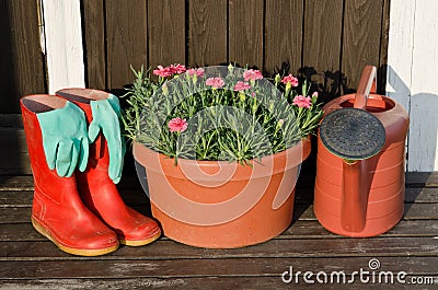 Garden tools:flower pot,watering can,rubber boots Stock Photo