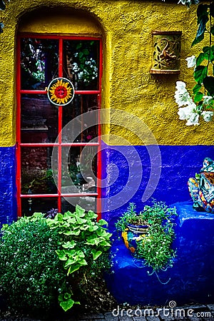 Garden Window in Blue and Yellow Wall Stock Photo