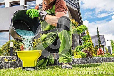 Garden Worker Preparing Grass Fertilizer Stock Photo