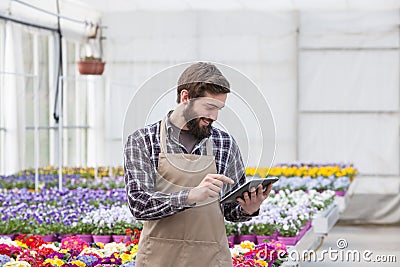 Garden worker with tablet Stock Photo