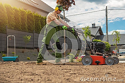 Gardener with Gasoline Engine Aerator Stock Photo