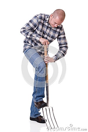 Gardener with a hayfork Stock Photo