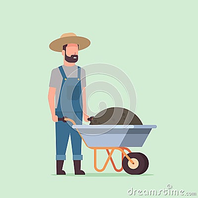 Gardener man pushing wheelbarrow full of earth compost male farmer working in garden wearing overalls gardening concept Vector Illustration