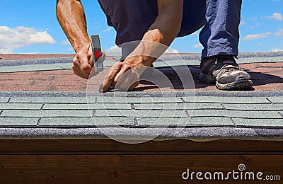 Gardener renew roof of summer garden house Stock Photo