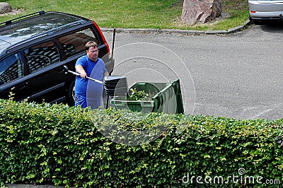 GARDENER WORKING BUSHES AND PLANT IN KASTRUP Editorial Stock Photo