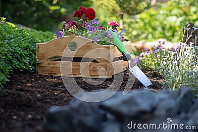 Gardening. Crate Full of Flowerpots and Garden Tools Ready for Planting In Sunny Garden. Spring Garden. Stock Photo