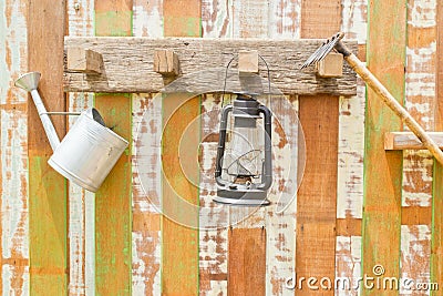 Gardening tools hanging on wooden wall Stock Photo
