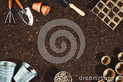 Gardening tools on soil background. Working in the garden Stock Photo