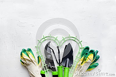 Gardening tools on white background, flat lay, copy space, top view. Concept of hobby, springtime, garden maintenance, landscaping Stock Photo