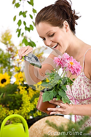 Gardening - woman holding flower pot and shovel Stock Photo