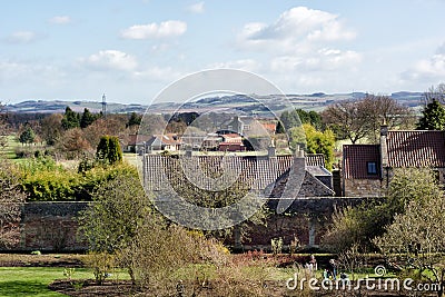 Gardens of Falkland Palace and the village of Falkland in Scotland. Gardeners working in the garden in springtime Editorial Stock Photo