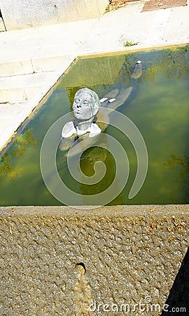 Gardens with sculpture of child swimming in Collblanc Editorial Stock Photo