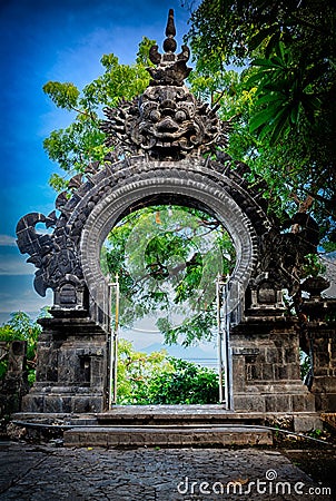 Gardian statue gate at entrance Bali temple Stock Photo