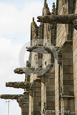 Gargoyles decorate the facade of a basilica (France) Stock Photo