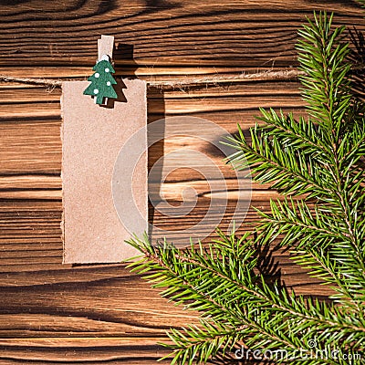 Garland with cute empty little kraft paper stickers hanging on a rope on wooden clothespins. Rustic Christmas decoration. Stock Photo