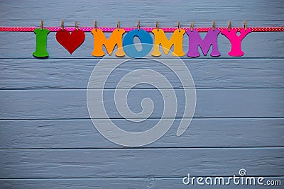 Garland with text `I love mommy` of colorful paper alphabet Stock Photo