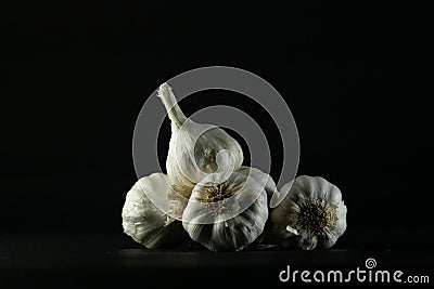 garlic bulbs on black background Stock Photo