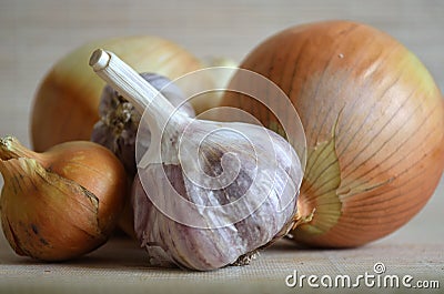 Garlic and bulbs on a light background Stock Photo