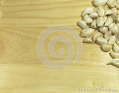 Garlic bulbs on wooden chopping board Stock Photo