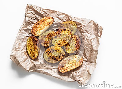 Garlic grilled potatoes baked on a light background top view Stock Photo